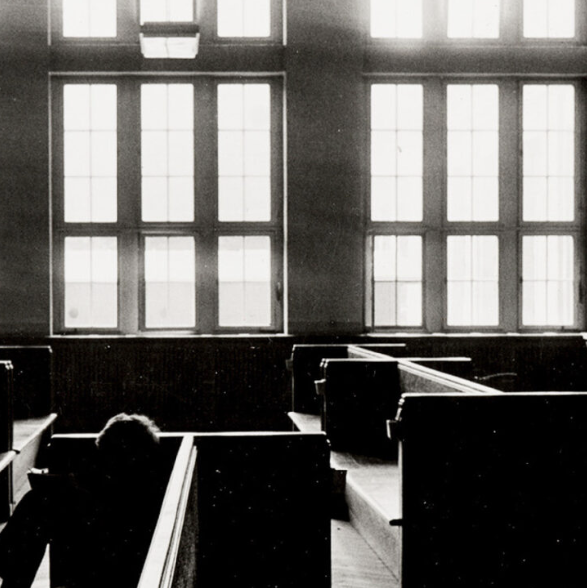 A photo of an empty classroom, in black and white.