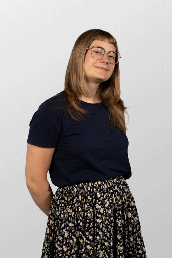 A picture of me, standing in front of a white wall. A standard portrait. But I look happy.